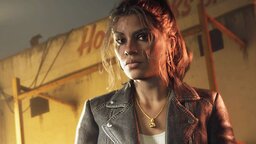 GTA 6 protagonist Lucia stands at night in front of a lit building