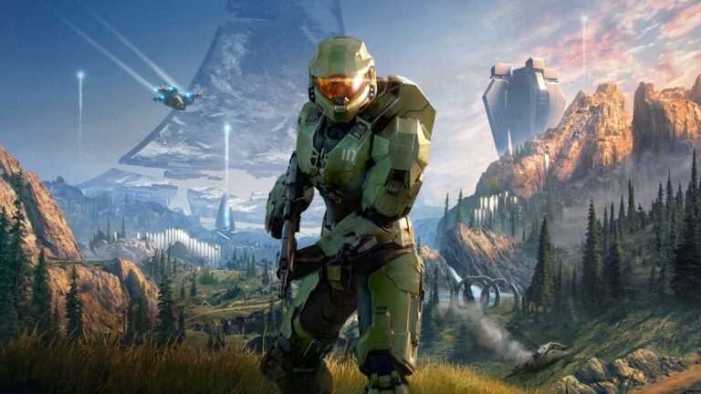 Master Chief in green armor stands with a weapon in hand in front of a landscape with a damaged Halo Ring in the background