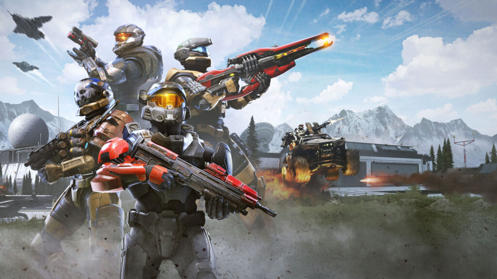 Vier bewaffnete Spartans in bunter Rüstung kämpfen gemeinsam in einer verschneiten Halo-Infinite-Umgebung