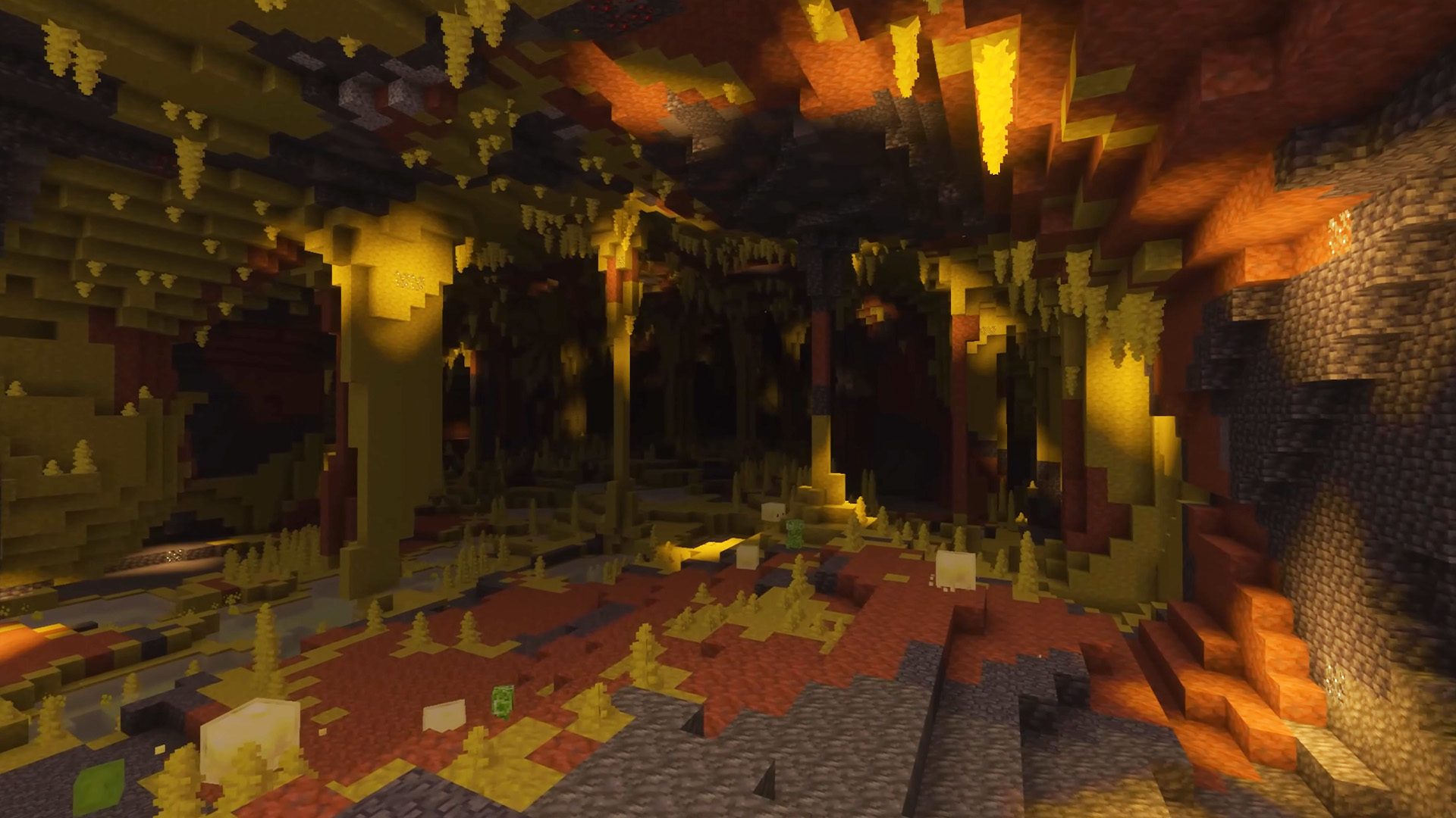 Minecraft-Screenshot einer unterirdischen Nether-ähnlichen Höhle mit goldenem Licht