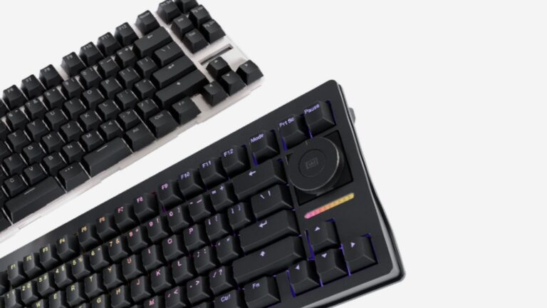 Two Wooting gaming keyboards with the visible new rotary knob photographed side-by-side