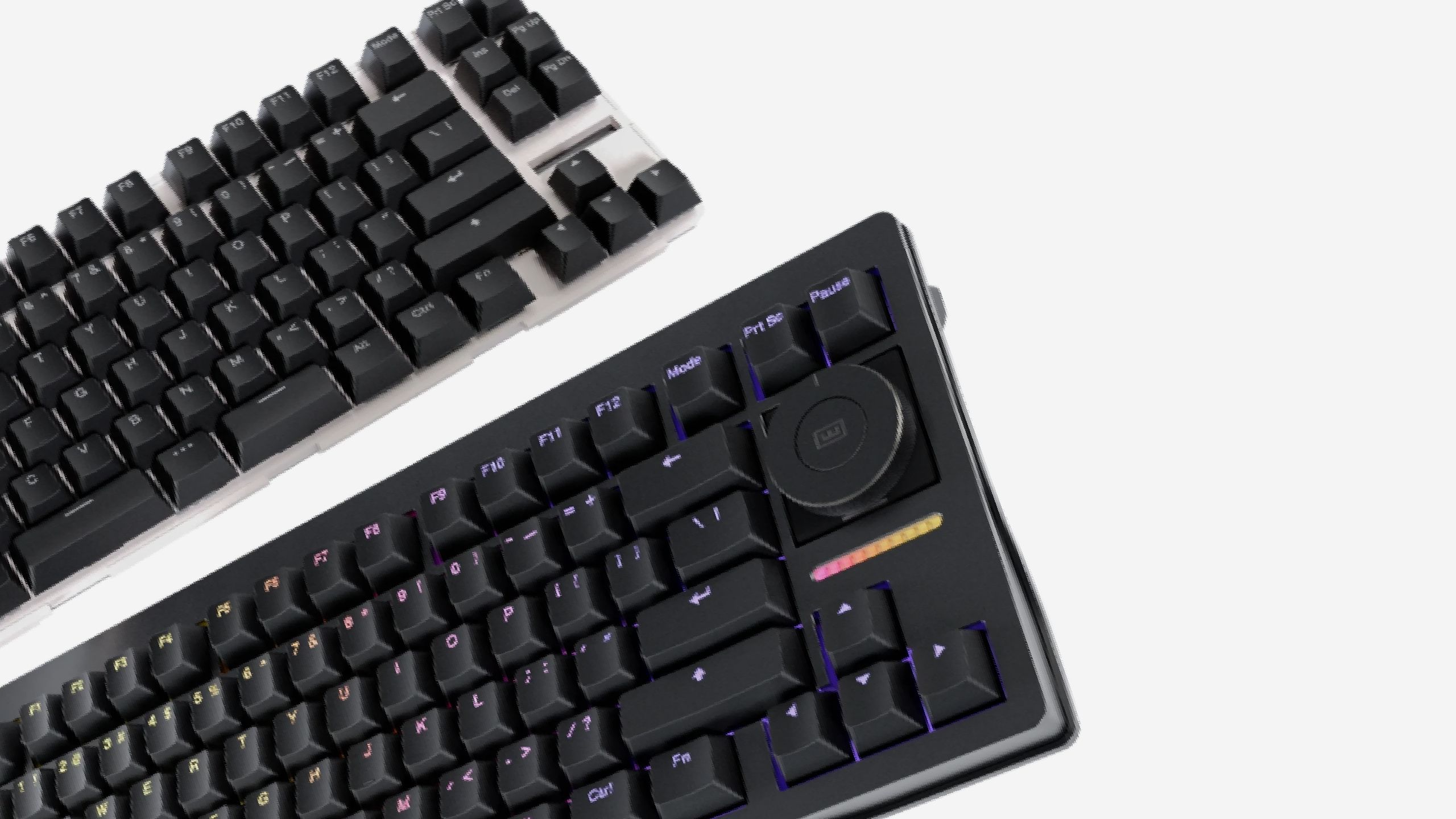 Zwei Wooting-Gaming-Tastaturen mit sichtbarem neuen Dreh-Regler nebeneinander fotografiert