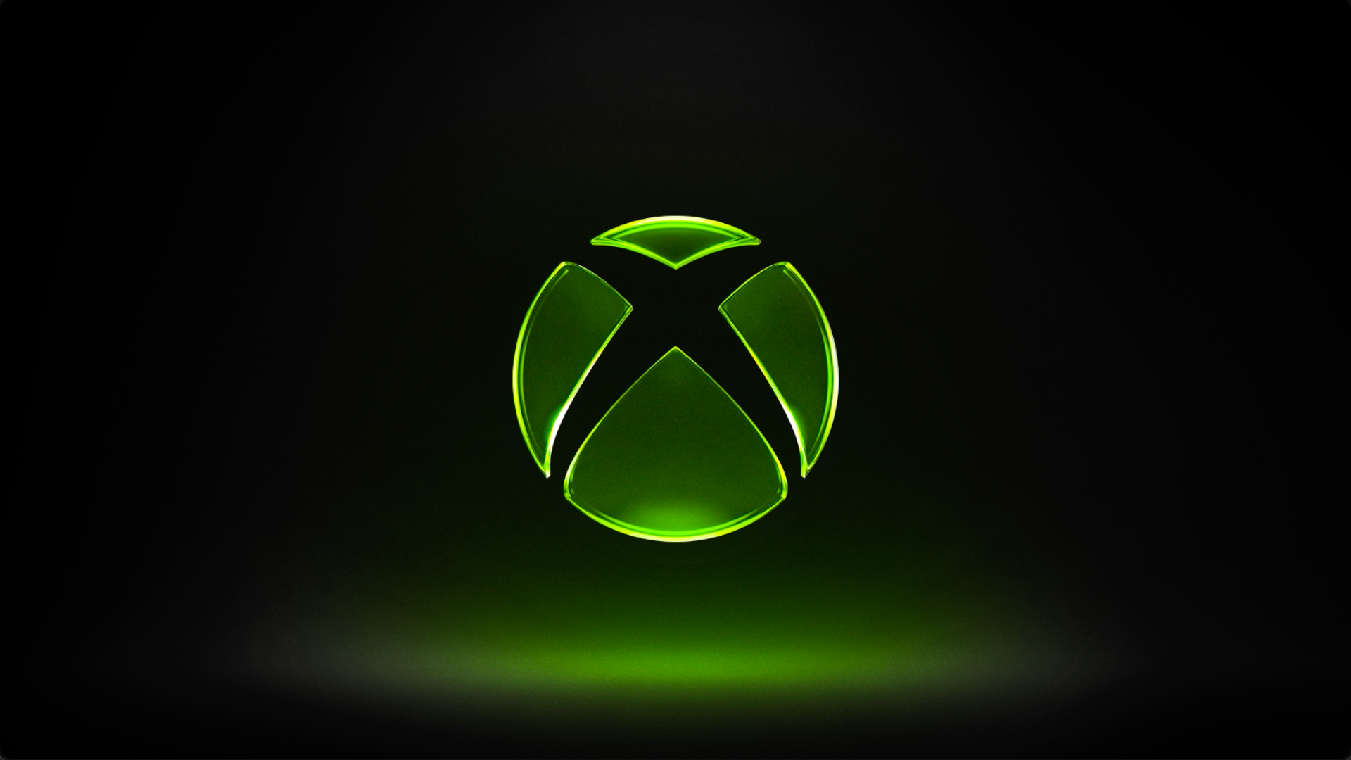 Das leuchtende grüne Xbox-Logo vor schwarzem Hintergrund, offizielles Pressebild von Xbox Wire