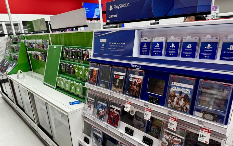 Shelf with console games and gift cards in an electronics store